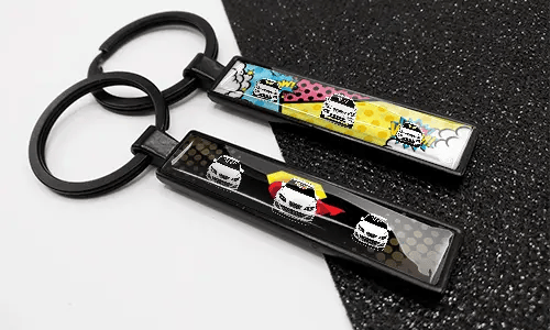 Comic-style license plate keychains featuring colorful designs and car illustrations