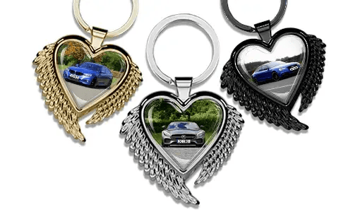 Heart-shaped keychain with wings and a photo of your car