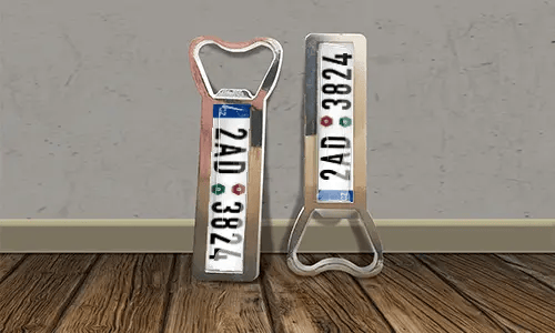 two bottle opener magnets on the floor