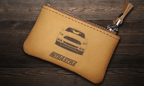 Brown leather key pouch with zipper, printed car and plate 