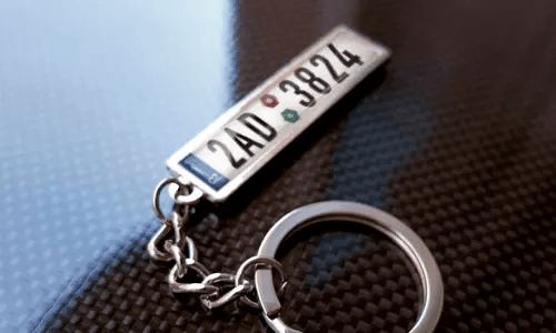 Metal keychain with flag design tag and chrome ring