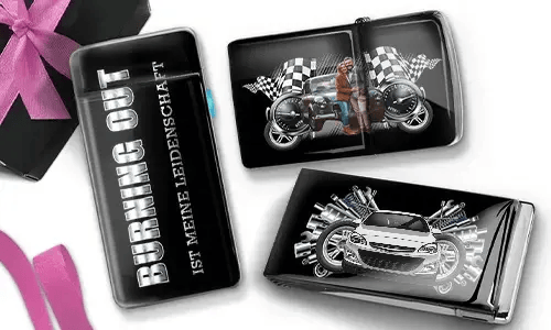 Three glossy cigarette cases with automotive themes. One reads 