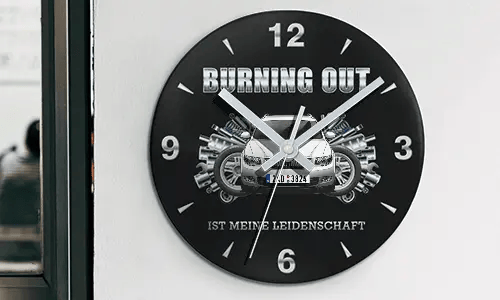 Wall clock with motorcycle and engine graphics, BURNING OUT IST MEINE LEIDENSCHAFT text on black face